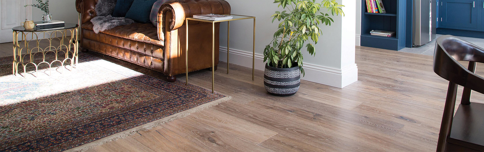 A light Ted Todd flooring with a green plant and