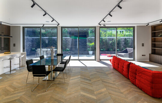 Smoke chevron in a room with big windows and dining table