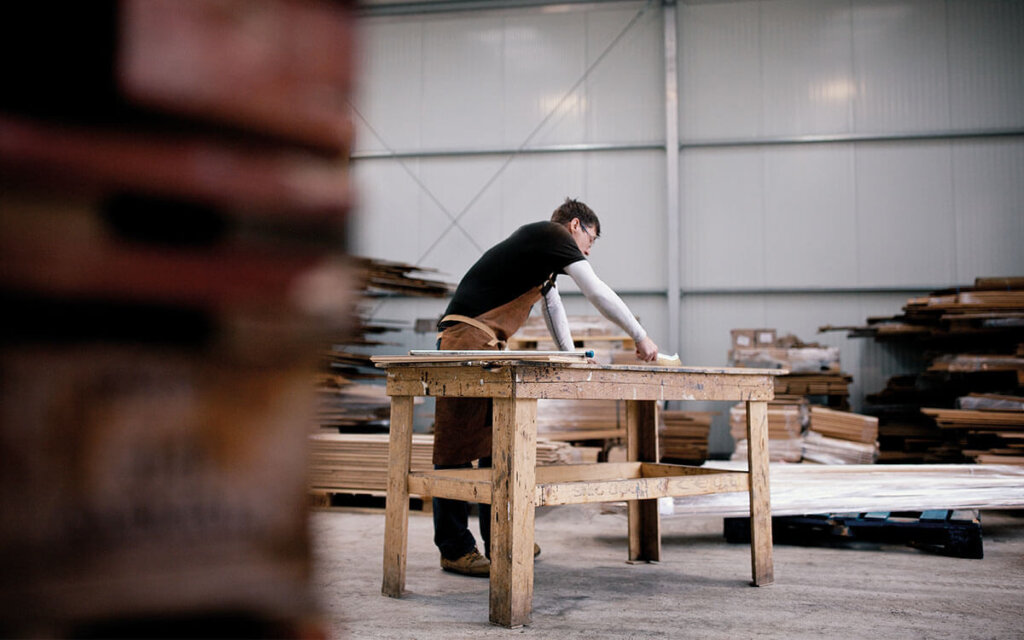 Woodworks artisan crafting handmade floors in the workshop