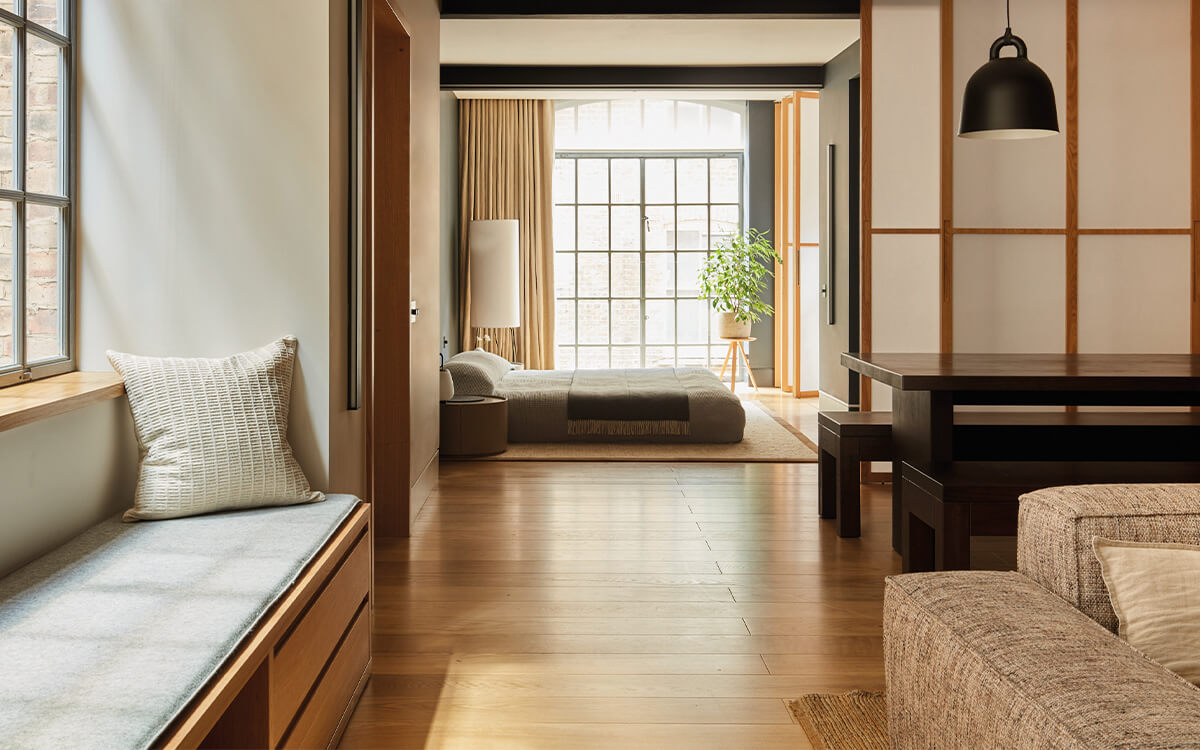 Soho Loft living space with window seating and view through to bedroom