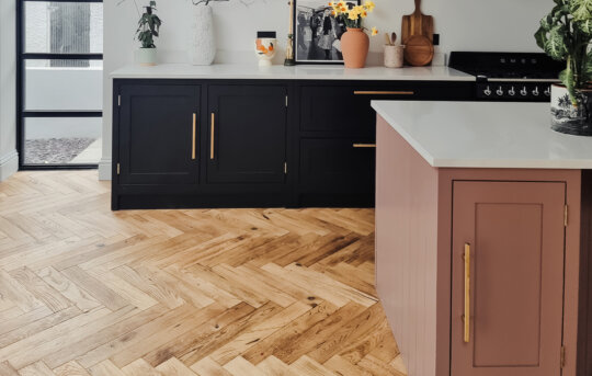 Standen Herringbone kitchen shot, pink island and black cabinets