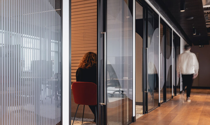 AstraZeneca open plan office image showing locker area and Woodworks bespoke wood floor