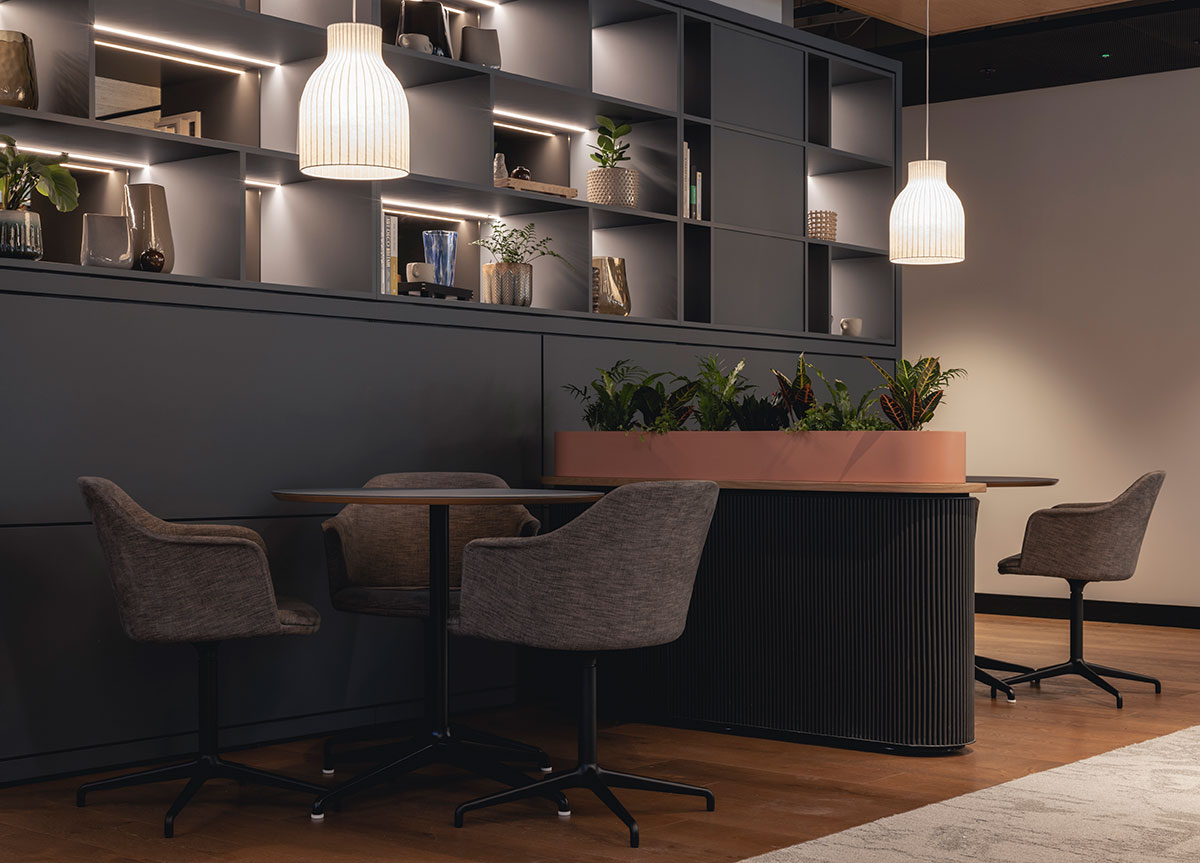 AstraZeneca breakout space with desks and chairs, shelving and a Woodworks bespoke wood floor