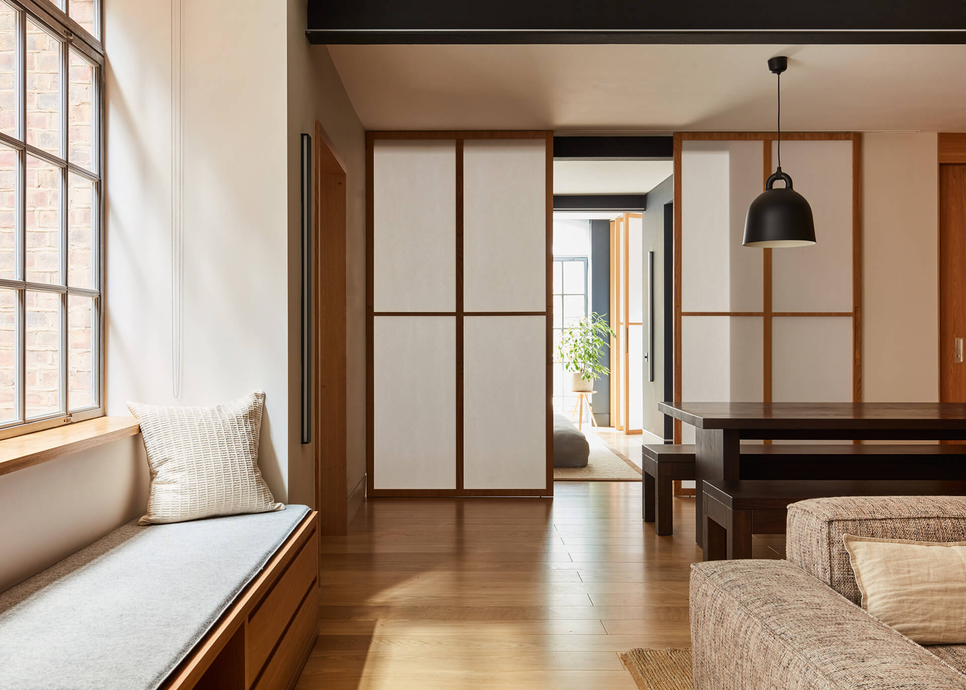 Soho Loft living room. Ashridge plank wood floor, window seating. rice paper doors.