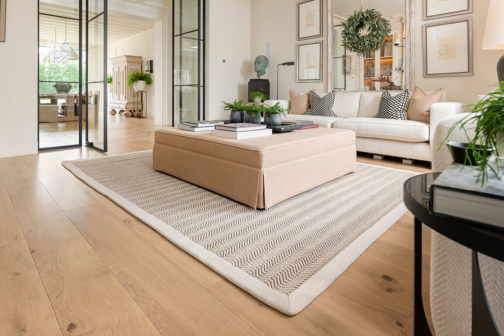Otis Plank intalled in living room with rug and coffee table